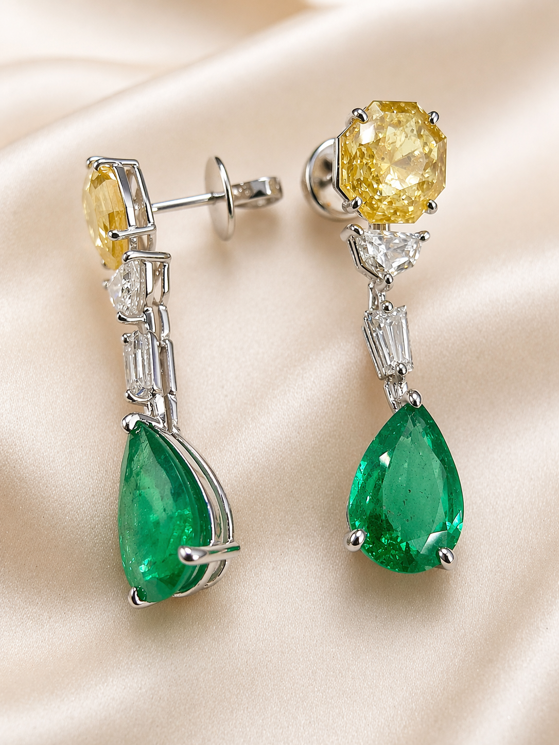 Exquisite earrings feature vibrant emerald drops, crowned with yellow sapphire and accented with lab-grown diamonds — a perfect harmony of color and sparkle.