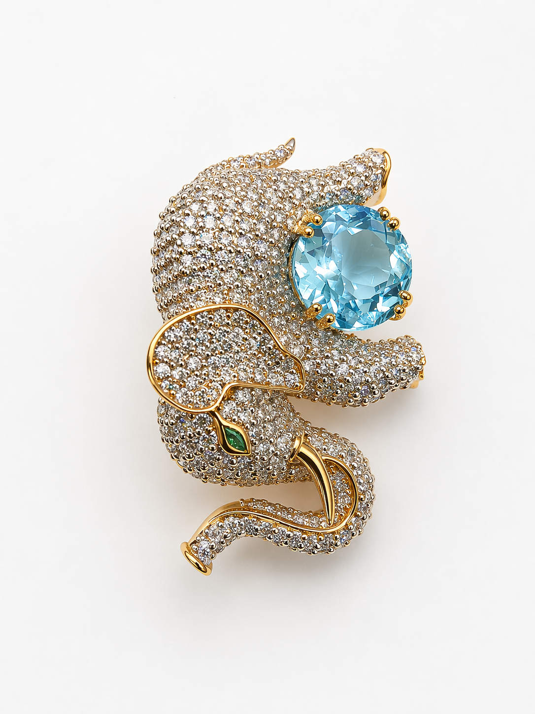 Handcrafted in 925 silver with premium gold plating, this zircon-studded elephant brooch with blue topaz gives a high-end designer look — without the heavy price tag
