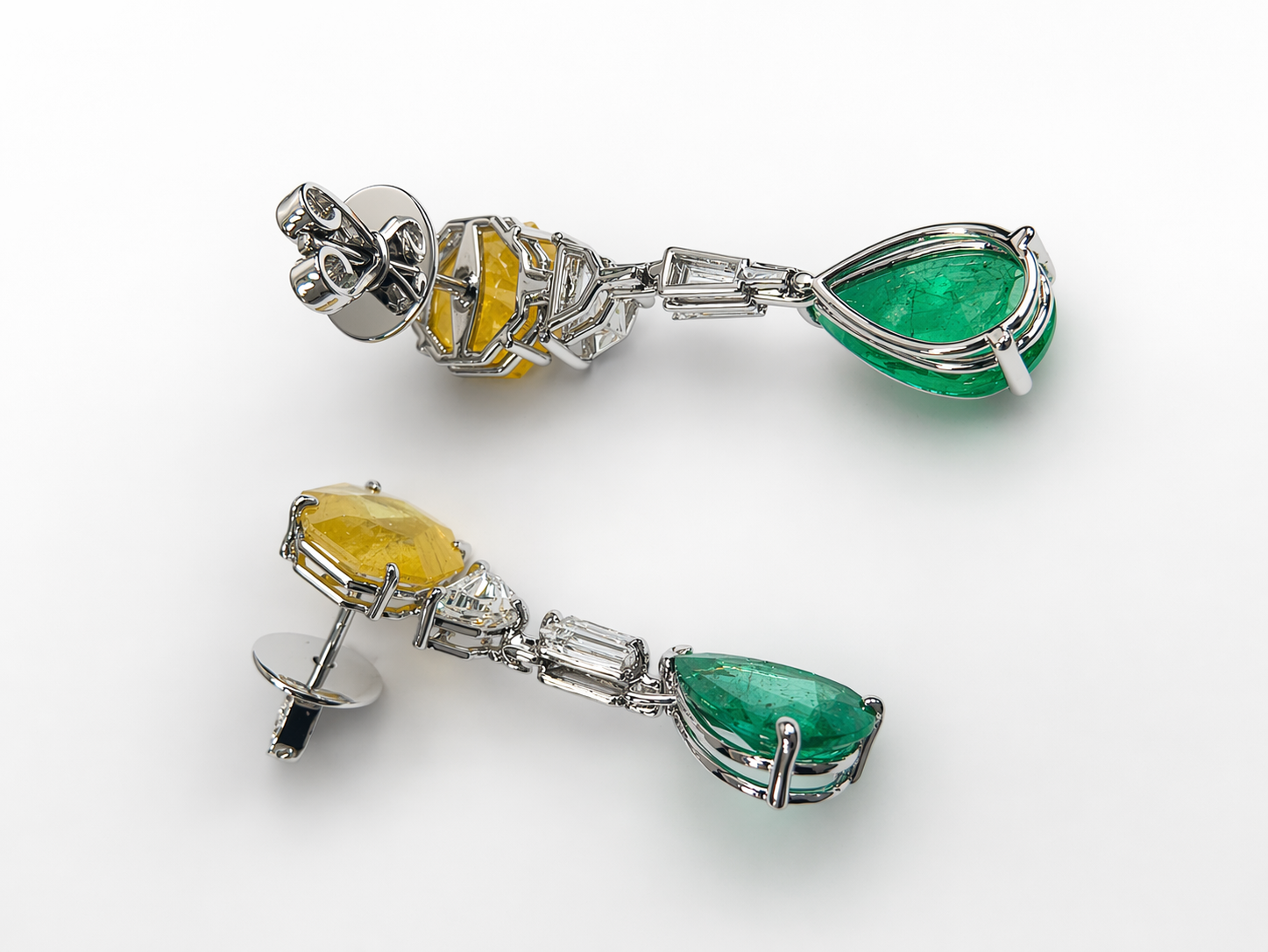 Exquisite earrings feature vibrant emerald drops, crowned with yellow sapphire and accented with lab-grown diamonds — a perfect harmony of color and sparkle.