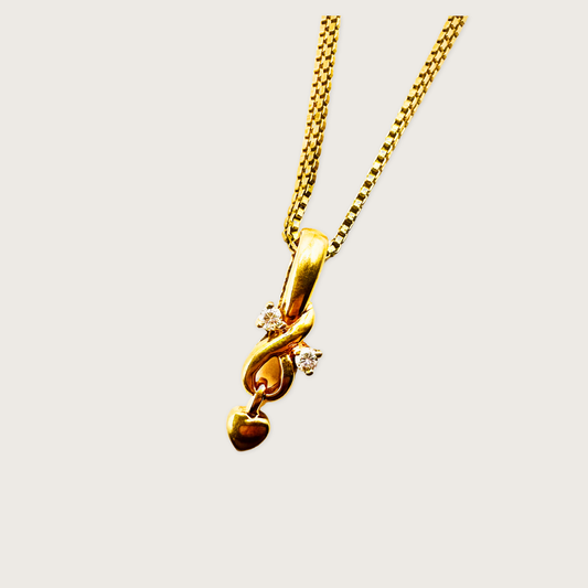 Twirl of Love – Diamond Heart Pendant in 18K Gold